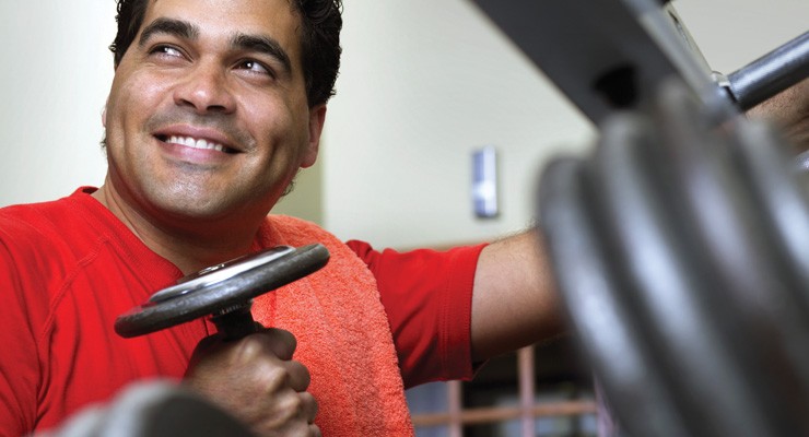 0112_Thinkstock_76762335 man with dumbbells at gym