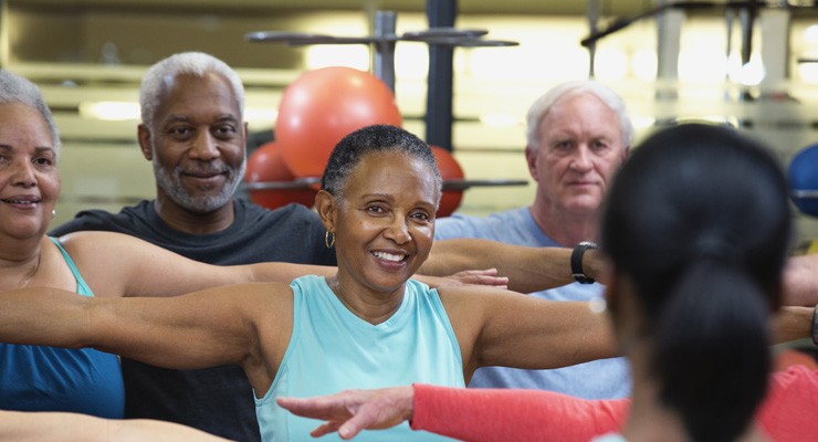 0231_503846957 group of men and women exercising